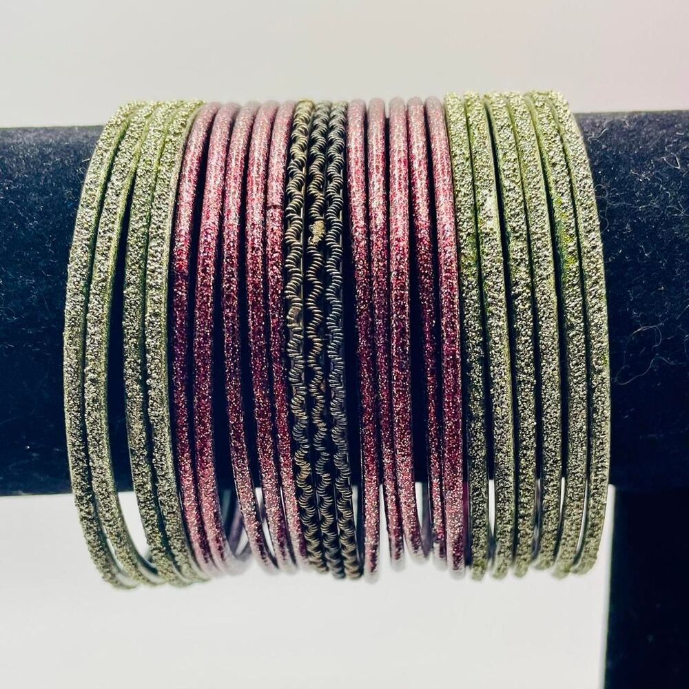 Black and purple glitter bangles. 23 bracelets. 7 1/4